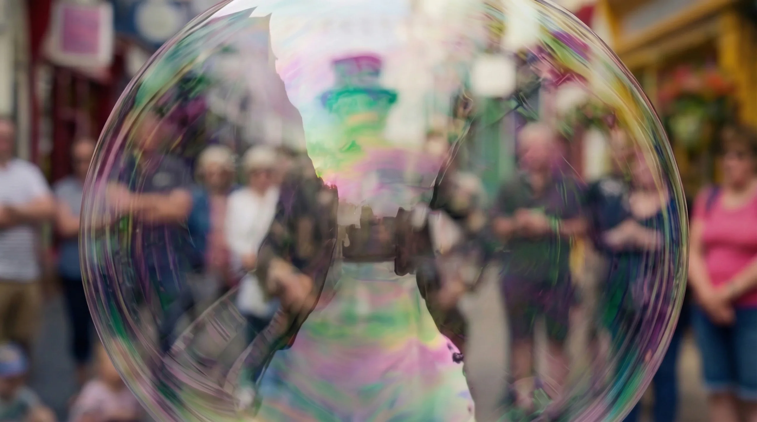 The giant bubble filling the frame before it bursts